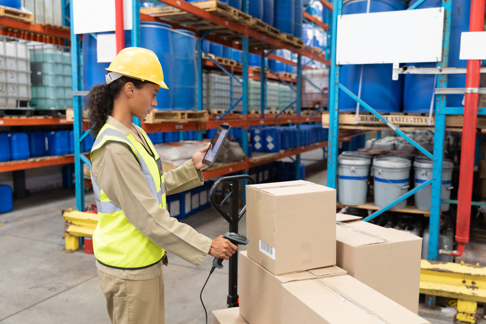 Side,view,of,female,worker,scanning,package,with,barcode,scanner